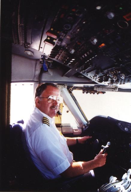 D.A. Francis at the controls in an airline cockpit